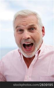 Excited gray-haired man
