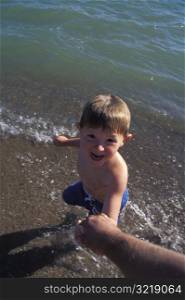 Excited Little Boy At The Ocean