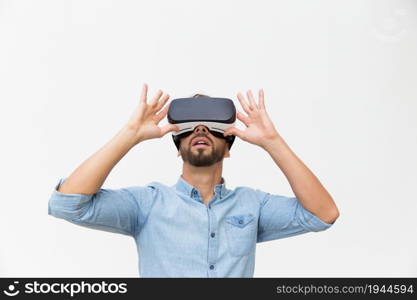 Excited male user wearing VR glasses