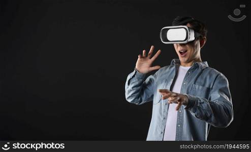 Excited male user wearing VR glasses