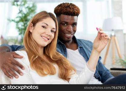 excited man and woman looking at camera