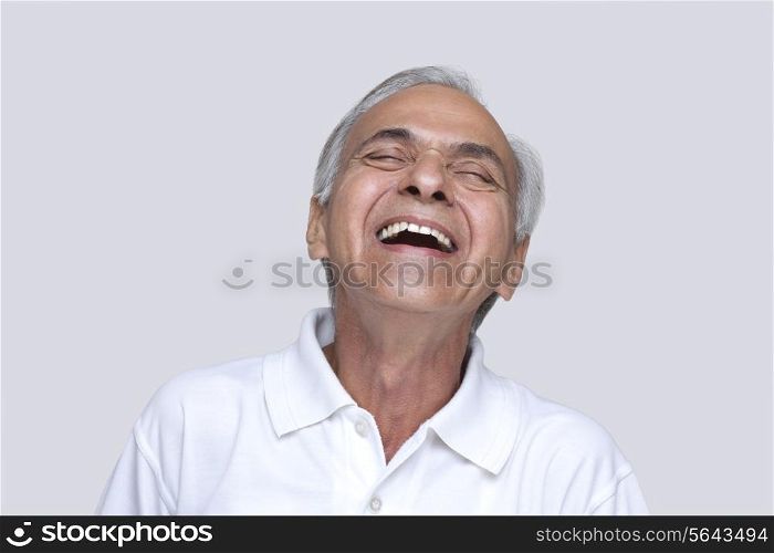 Excited man laughing with eyes closed
