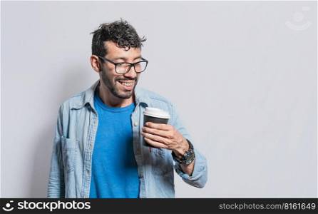 Excited person holding coffee glass on isolated background, Excited young man holding paper coffee cup, Excited man with coffee glass