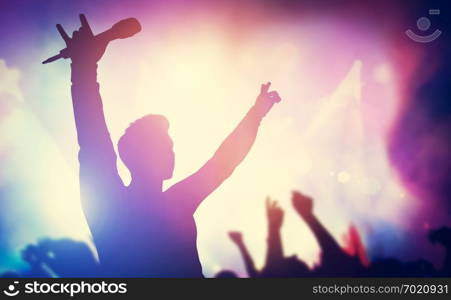 Excited singer raising hands on stage. Concert, musical gig. Entertainment, music industry. 3D illustration.. Excited singer raising hands on stage.