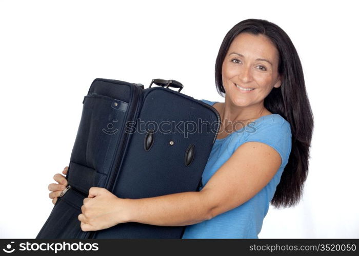 Excited woman with a heavy suitcase isolated on white background