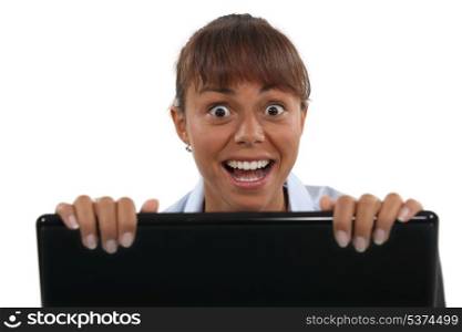 Excited woman with a laptop
