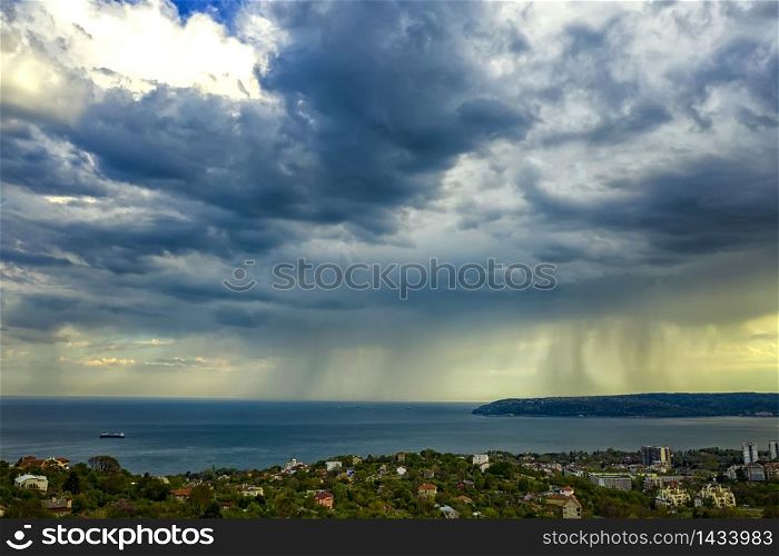 exciting stormy clouds and rain over the sea