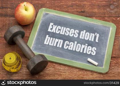 Excuse do not burn calories - fitness and exercise concept - slate blackboard sign against weathered red painted barn wood with a dumbbell, apple and tape measure