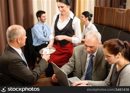 Executive business man pay restaurant bill during management meeting
