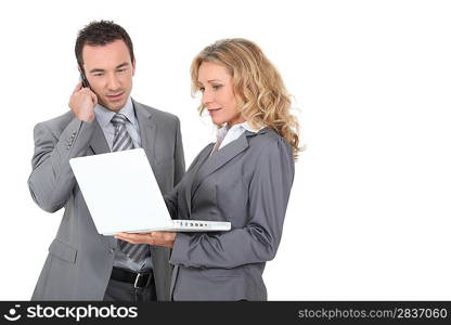 Executive couple with a laptop