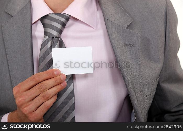 Executive holding a blank business card