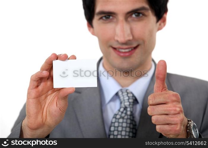 Executive holding a business card