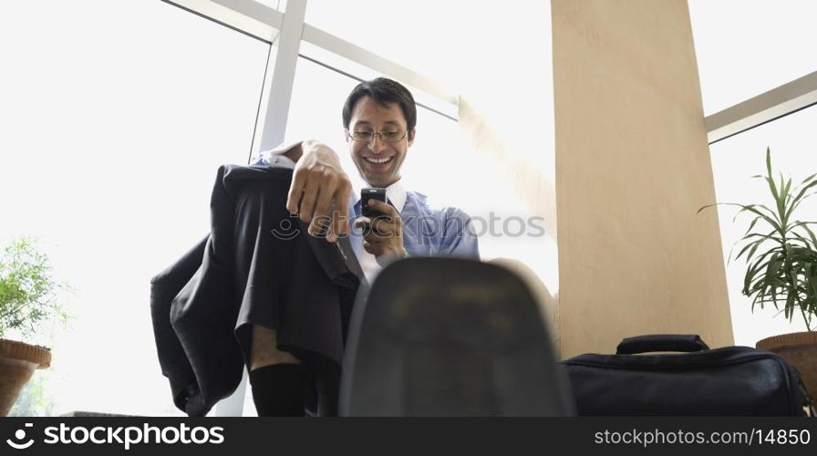 Executive holding a mobile phone