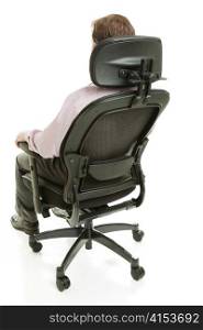 Executive sitting in a fully adjustable ergonomic office chair. Full body isolated on white.