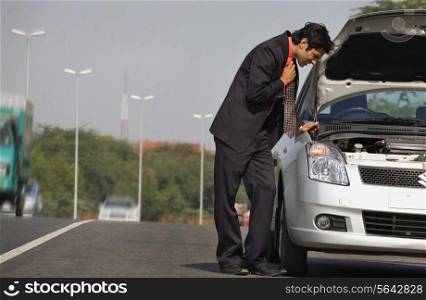 Executive stranded with a broken down car