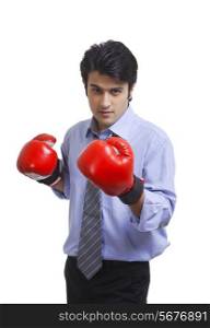 Executive wearing boxing gloves