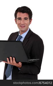 Executive with computer in hand