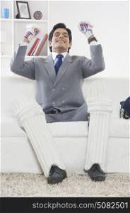 Executive with cricket gear rejoicing