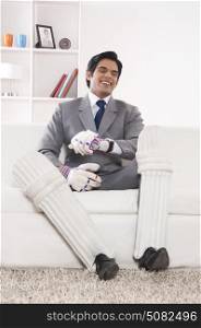Executive with cricket gear smiling