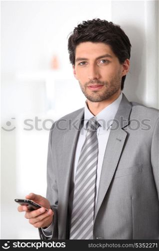 Executive with mobile phone