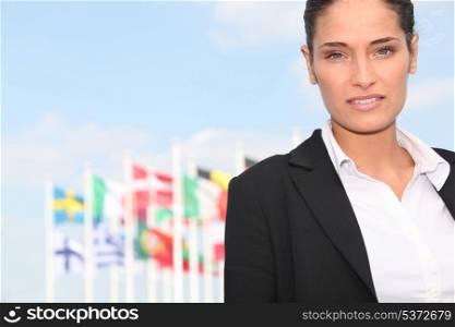 Executive Woman in front of flags