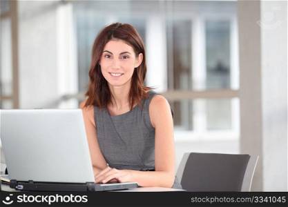 Executive woman working on laptop computer