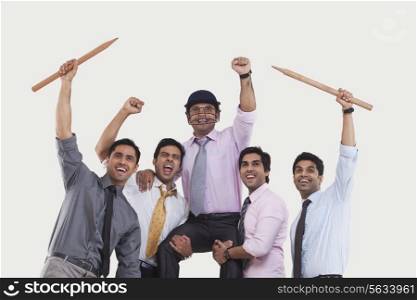 Executives cheering during cricket match