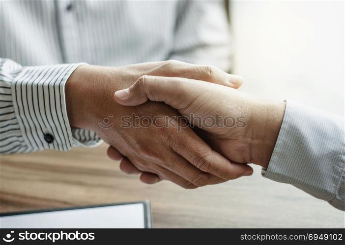 executives hand shaking with lawyer consultant at a office