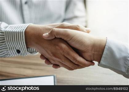 executives hand shaking with lawyer consultant at a office