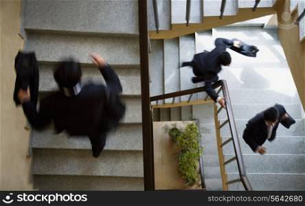 Executives running up the stairs