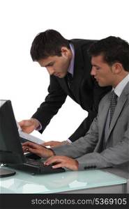 Executives working on laptop