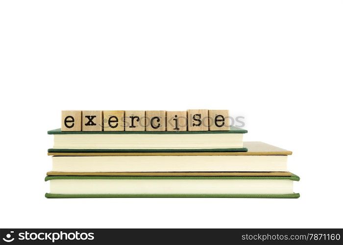 exercise word on wood stamps stack on books, homework and learning concept