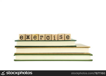 exercise word on wood stamps stack on books, homework and learning concept