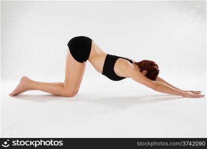 exercising woman. fitness exercising woman on her knees stretching
