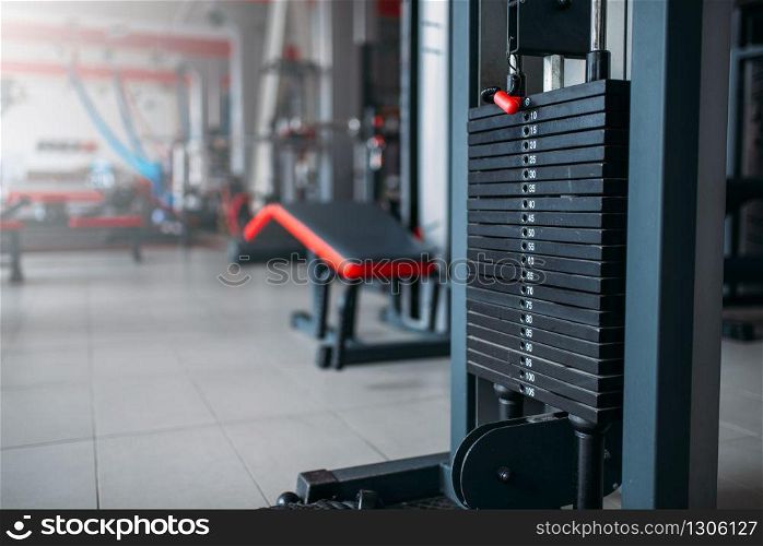 Exersice machine closeup, sport equipment in gym, fitness club interior