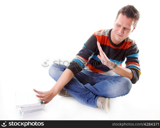 Exhausted and tired student with pile of books on white background