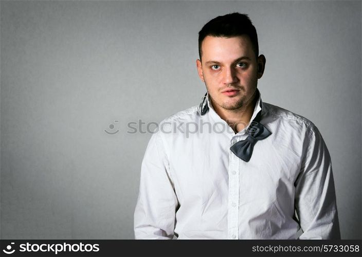 exhausted business man on gray background