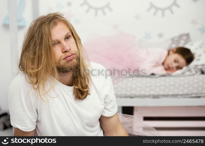 exhausted father sleepy daughter home