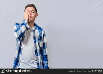 Exhausted person putting the palm of his hand on his face. Tired and exhausted man covering his face with the palm of his hand isolated, Concept of a bored and tired man