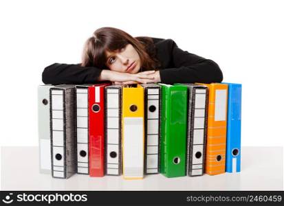 Exhausted woman in the office resting over the folders, isolated on white background