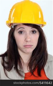 Exhausted young female builder