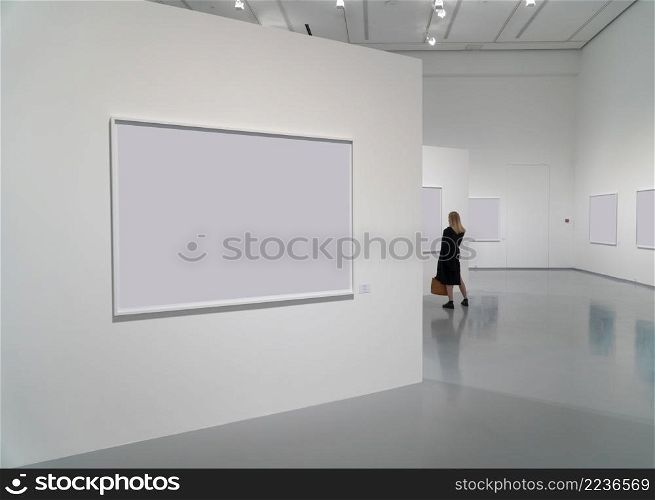 exhibition room of the gallery with blank pictures and people. complex of exhibition galleries