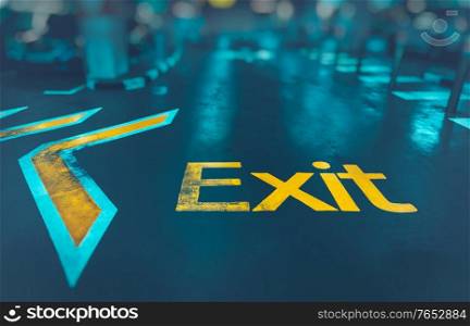 Exit background, big yellow arrow to exit from subway, direction sign, conceptual imahe of the way out, urban life, modern underground system