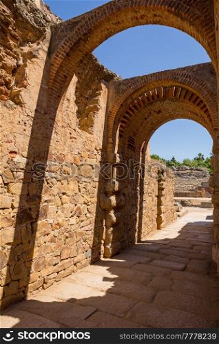 Exit gateway with arches of Roman Amphitheater, at the huge archaeological site of Merida. Founded by ancient Rome in western Spain