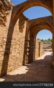 Exit gateway with arches of Roman Amphitheater, at the huge archaeological site of Merida. Founded by ancient Rome in western Spain