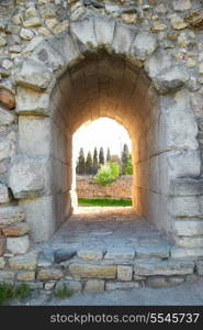 Exit in the ancient wall. Entrance to the green park