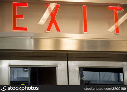 Exit sign above a door, New York City, New York State, USA