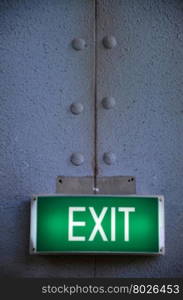 Exit sign points the way out of building