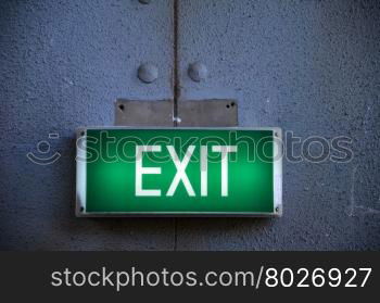 Exit sign points the way out of building