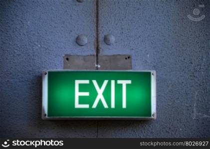 Exit sign points the way out of building